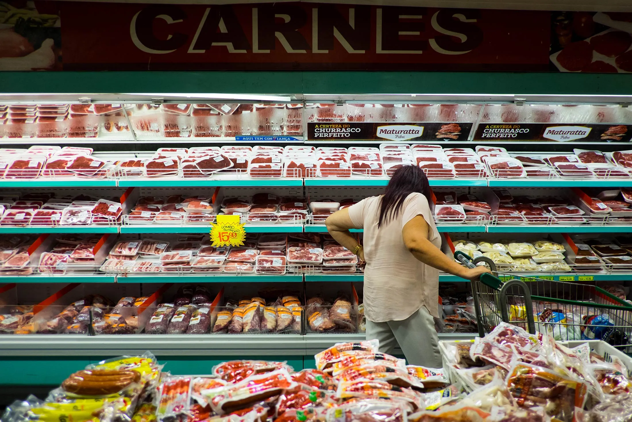A customer shops for meat in a supermarket in Sao Paulo, Brazil, on March 17.
