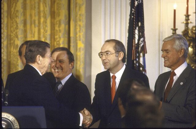 (R-L) Senators Ernest Hollings, Phil Gramm, Warren Rudman, President Ronald Reagan, at White House celebration, re passage of Gramm/Rudman Hollings Budget Bill. December 01, 1985.