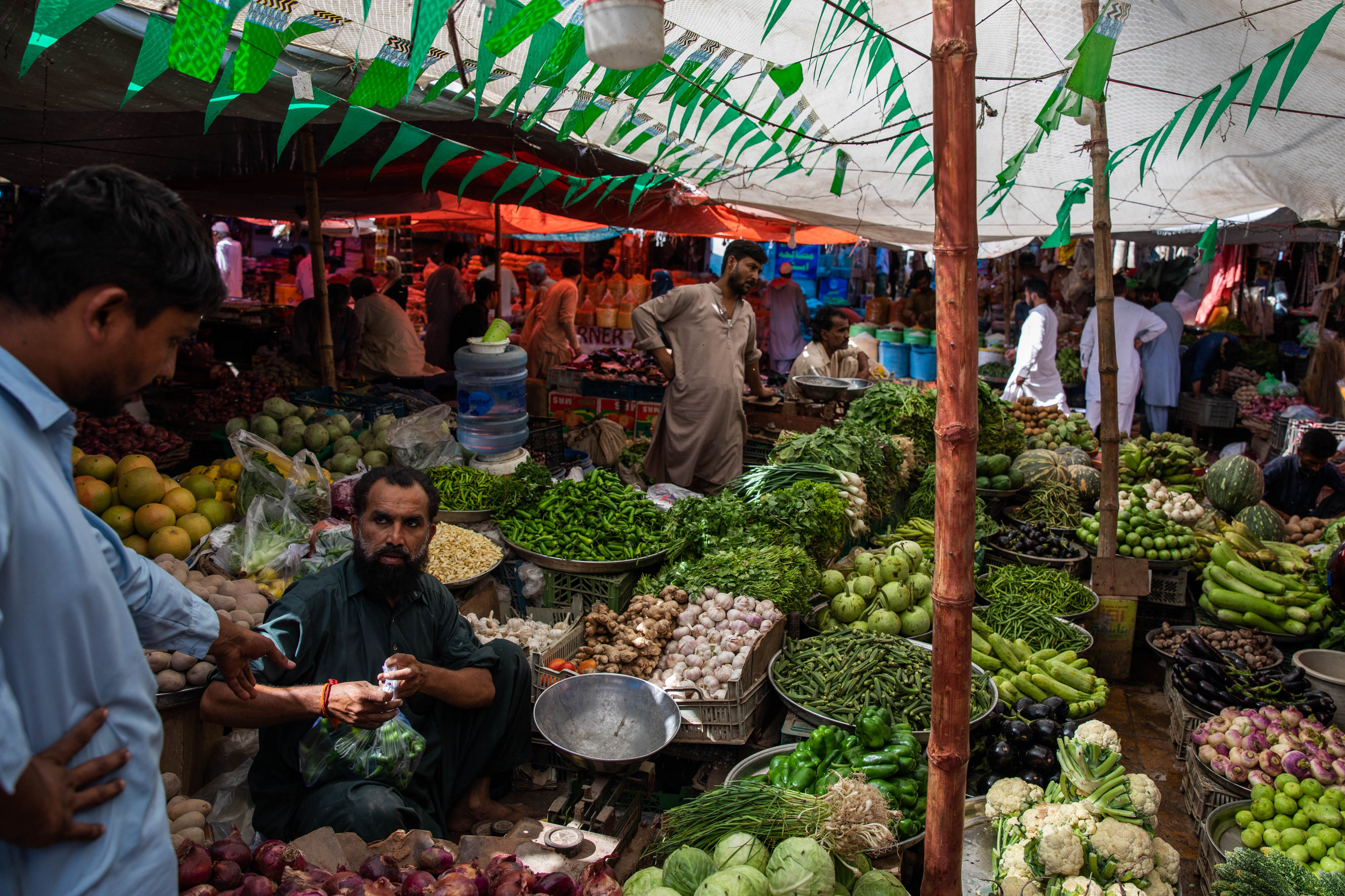 Malaysian Grocery Shoppers in a shopping frenzy at a Vegetable