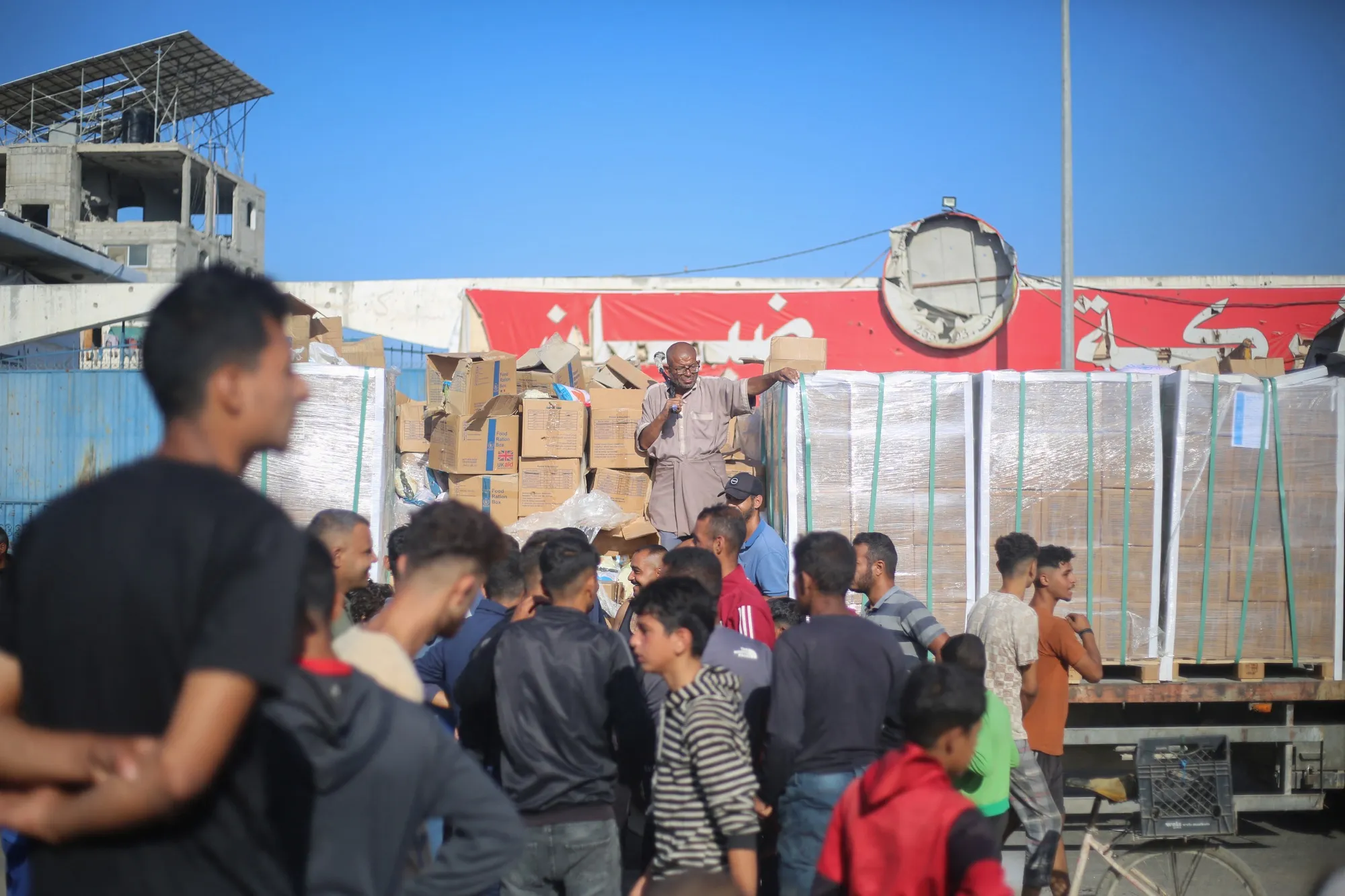 Displaced Palestinians wait for aid supplies at the Nuseirat refugee camp in the Gaza Strip, on Oct. 20.