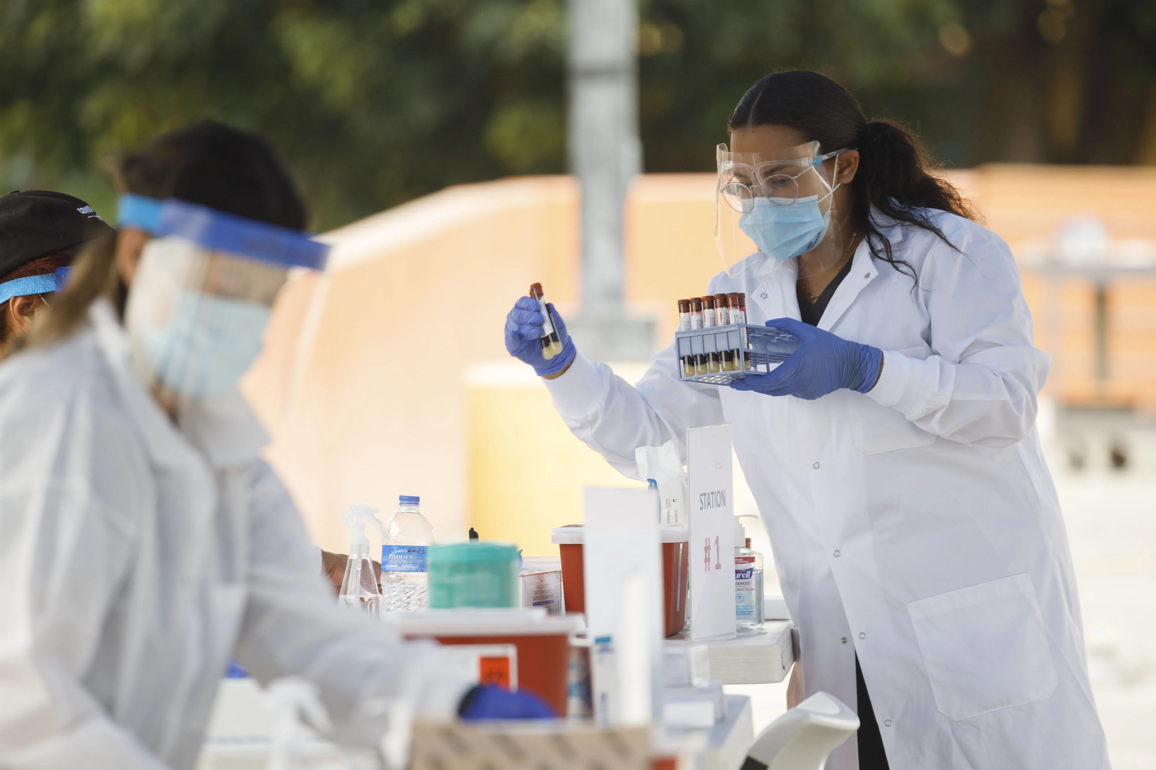 A worker&nbsp;inspects blood samples for Covid-19 antibody tests&nbsp;at a testing site in Los Angeles, on&nbsp;Aug. 5.