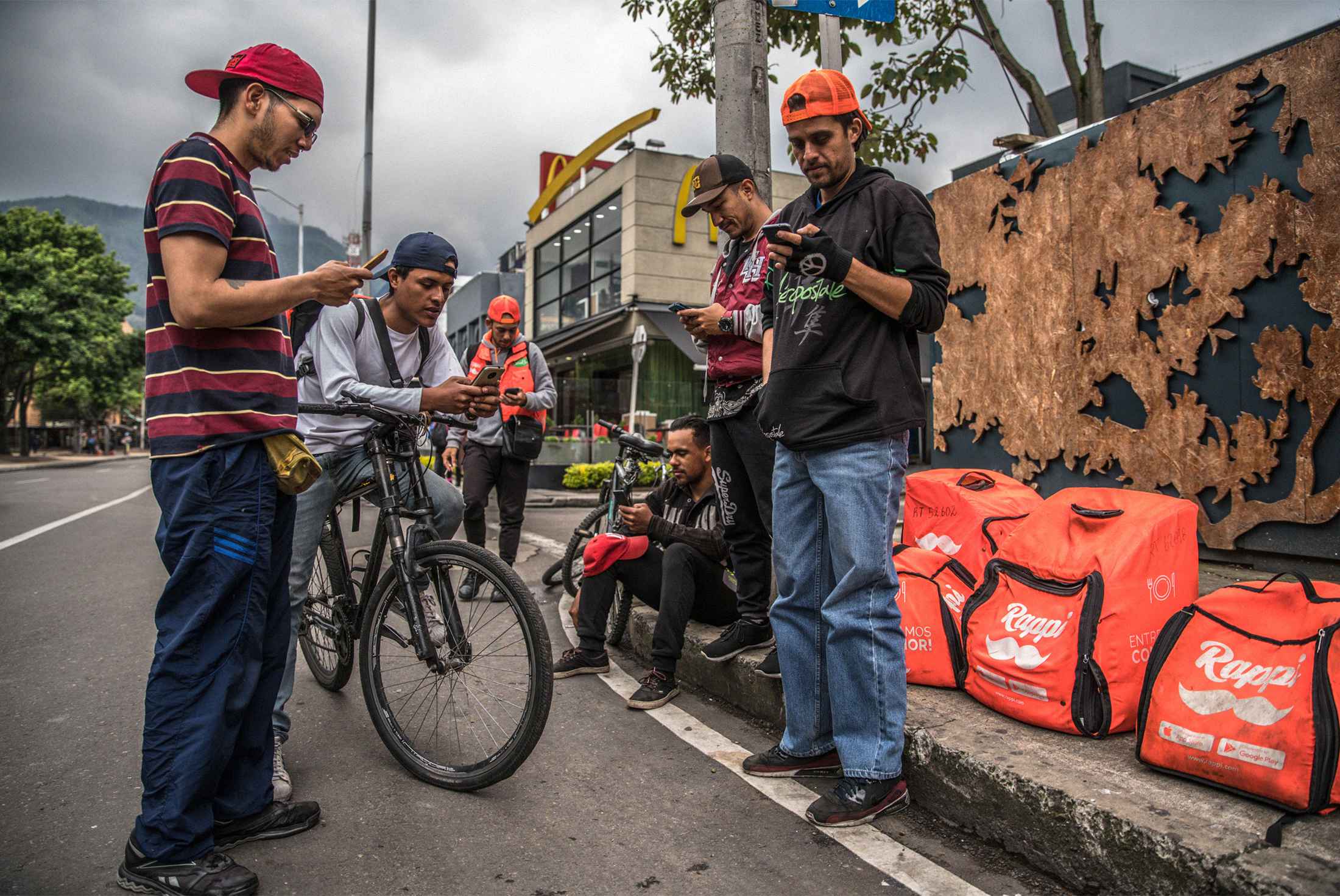 Rappi couriers in Bogotá await their next assignment.