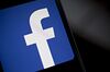 The Facebook Inc. logo is displayed for a photograph on an Apple Inc. iPhone in Washington, D.C., U.S., on Wednesday, March 21, 2018. Facebook is struggling to respond to growing demands from Washington to explain how the personal data of millions of its users could be exploited by a consulting firm that helped Donald Trump win the presidency.