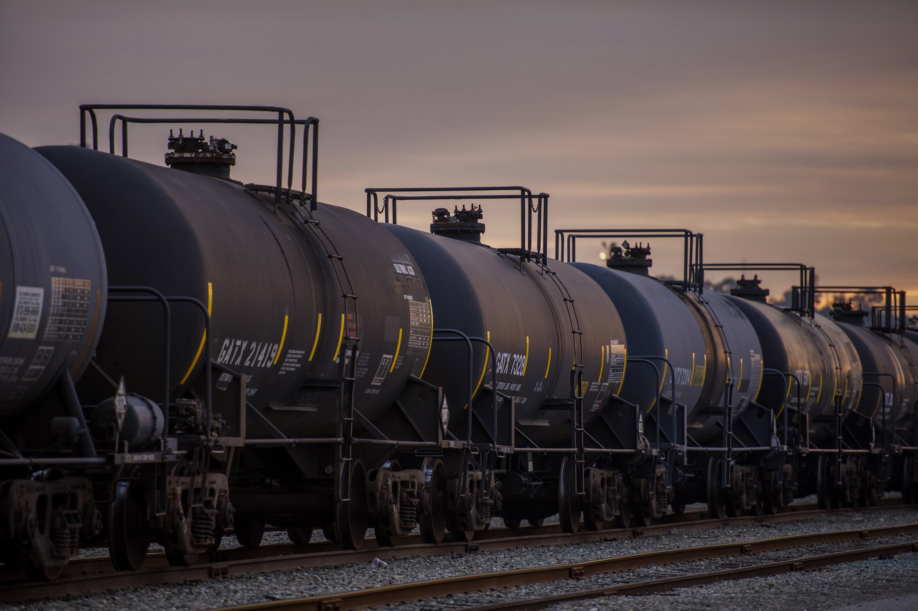 Oil tankers sit at a rail yard at the Kinder Morgan Inc. facility in Richmond, California, U.S., on Friday, Nov. 21, 2014. Crude-oil handling facilities at the end of rail lines from Albany, New York, to Richmond, California, are mired in lawsuits filed by community and environmental groups claiming they were kept in the dark about the projects.