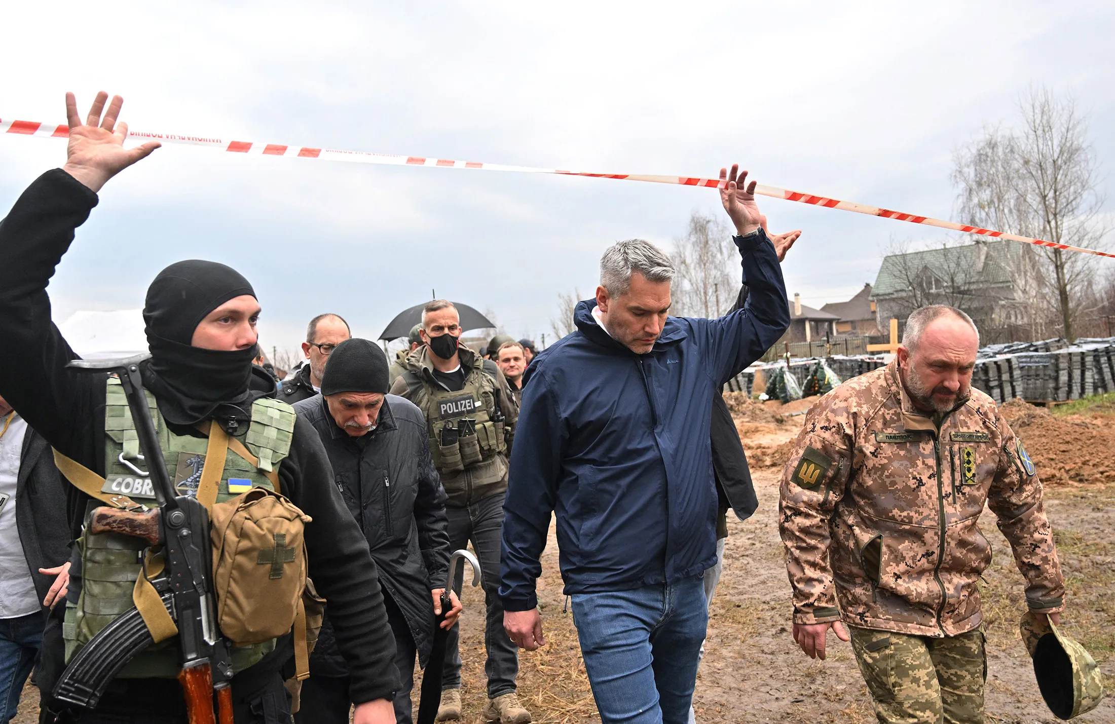 Austrian Chancellor Karl Nehammer, second right, visits&nbsp;the site of a mass grave in the Ukrainian town of Bucha, near Kyiv on April 9.