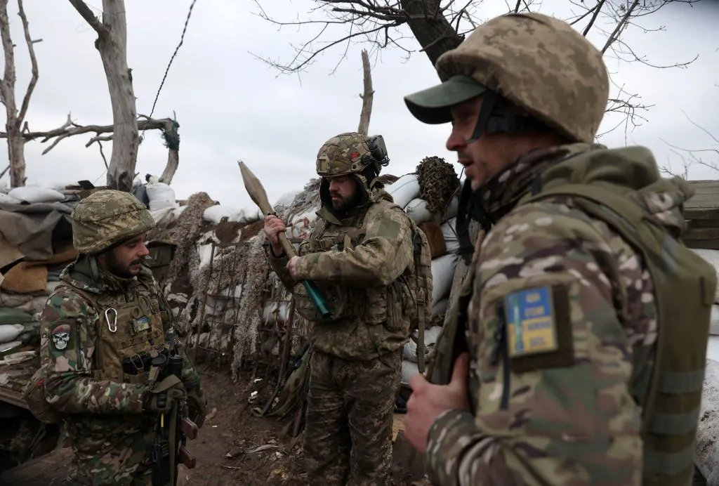 Ukrainian servicemen in a trench on a frontline position in the Donetsk region.