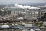Emissions rise from a Marathon Petroleum Corp. oil refinery in Texas City, Texas, on Aug. 30, 2017. 