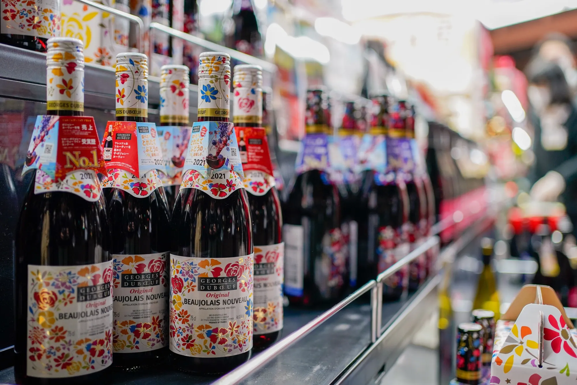 Bottles of Georges Duboeuf Beaujolais Nouveau wine in a store in Tokyo, Japan, in 2021.
