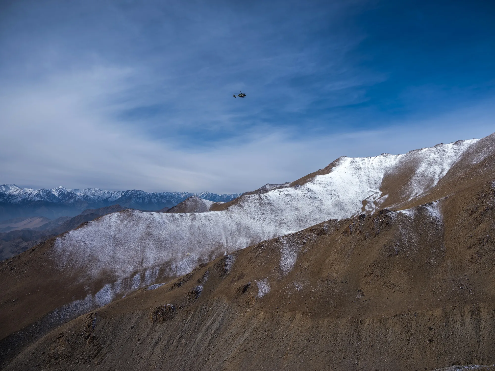 An Indian Armed Forces&nbsp;helicopter flies near the Khardung La pass in Ladakh, India, on Nov. 13, 2019.