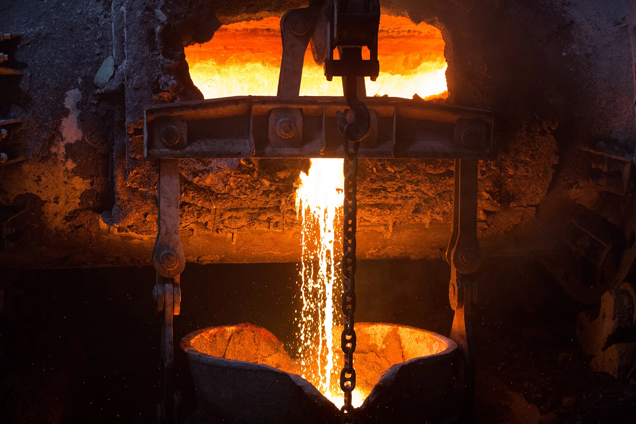 Molten liquid copper is poured from a furnace at the MMC Norilsk Nickel PJSC copper refinery in Norilsk.