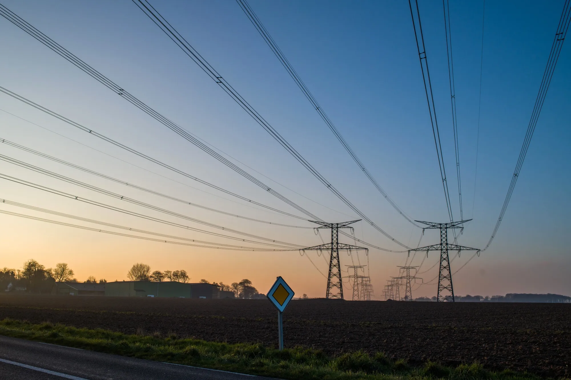 Electricity pylons and power lines near the Paluel nuclear power plant, in Normandy, France.