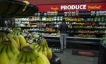 A shopper looks at produce in a grocery store in San Francisco.