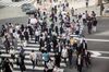 Pedestrians cross a road Ginza district of Tokyo, Japan, on Friday, May 25, 2018. The savings-rich elderly spend about 9.7 trillion yen ($87 billion) a year on their offspring and such spending last year accounted for about a third of the modest growth in total consumption, according to Hiromichi Shirakawa, chief Japan economist at Credit Suisse Group.