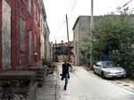 Nowhere to run: Sandtown-Winchester resident Nathaniel Silas in one of the the troubled neighborhood's alleys.