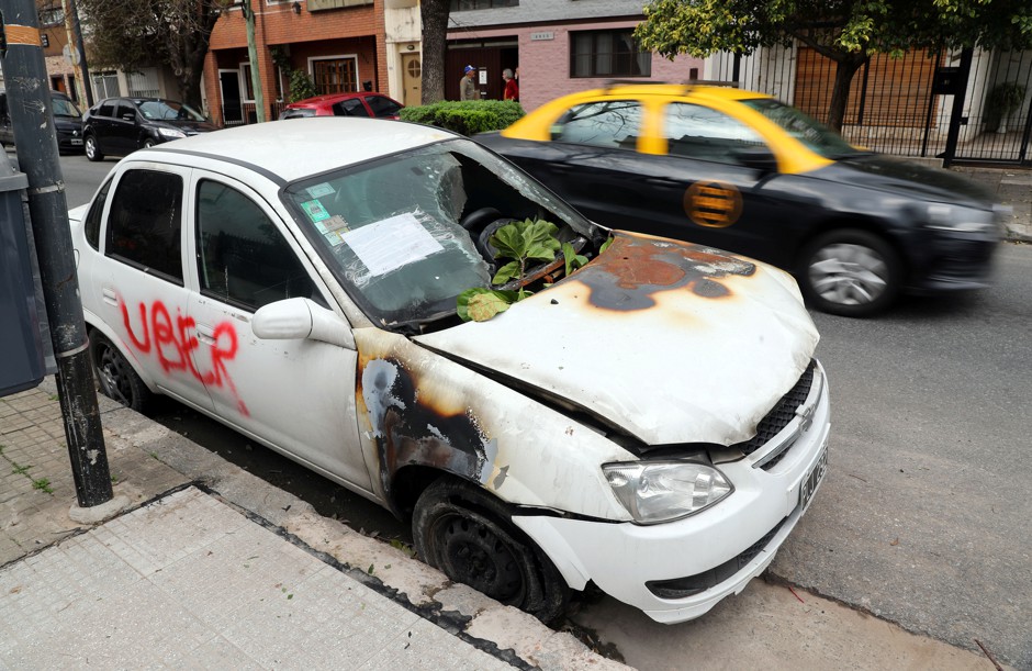 A car that was vandalized because it was allegedly used as an Uber vehicle in Buenos Aires.