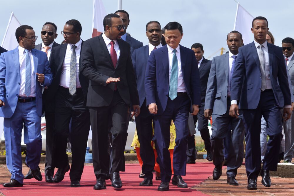 Abiy Ahmed and Jack Ma arrive for a ceremony to sign a memorandum to establish the eWTP in Addis Ababa on Nov. 25.