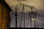 Electricity pylons hold power lines in Hayes, France.