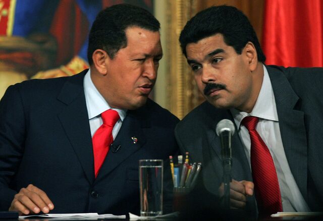 Venezuelan President Hugo Chavez (left) speaks with Maduro, then foreign minister, in October 2006. 