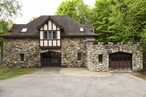 The property includes a two-bedroom carriage house and a two-bedroom gatehouse.