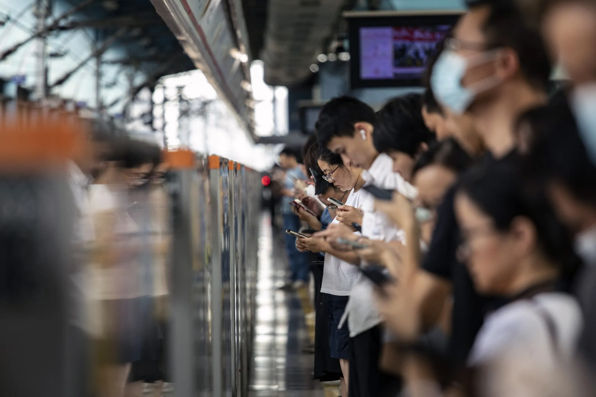 Commuters at a Shenzhen Metro station.