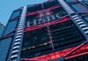 The logo for HSBC Holdings Plc is displayed on the bank\'s headquarters building in Hong Kong, China, on Sunday, July 30, 2017. HSBC is set to announce plans to buy back $2 billion of shares when it unveils second-quarter results on July 31, the Sunday Times reported, without saying where it got the information.