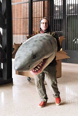 A crew member holding an essential prop