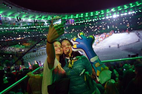 Spectators take a selfie picture during the Olympics closing ceremony in Rio de Janeiro on Aug. 21.
