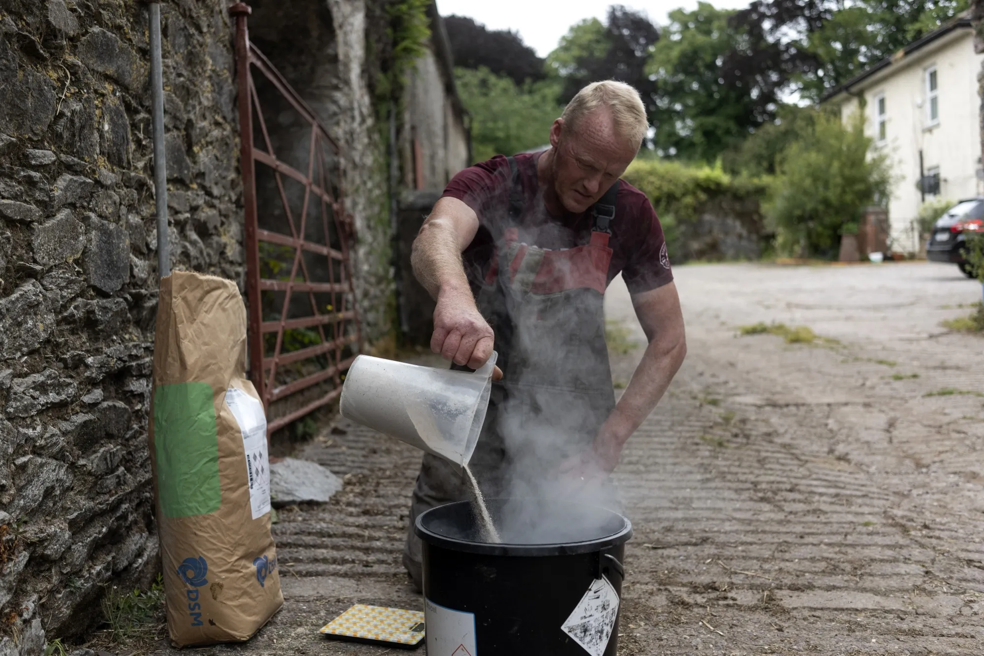 Irish dairy farmer Peter Hynes prepares the feed additive&nbsp;Bovaer&nbsp;at his family farm in Aherla, a small village in County Cork, Ireland.
