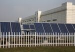 Solar panels stand in front of the Trina Solar Ltd. headquarters in Changzhou, Jiangsu Province, China.