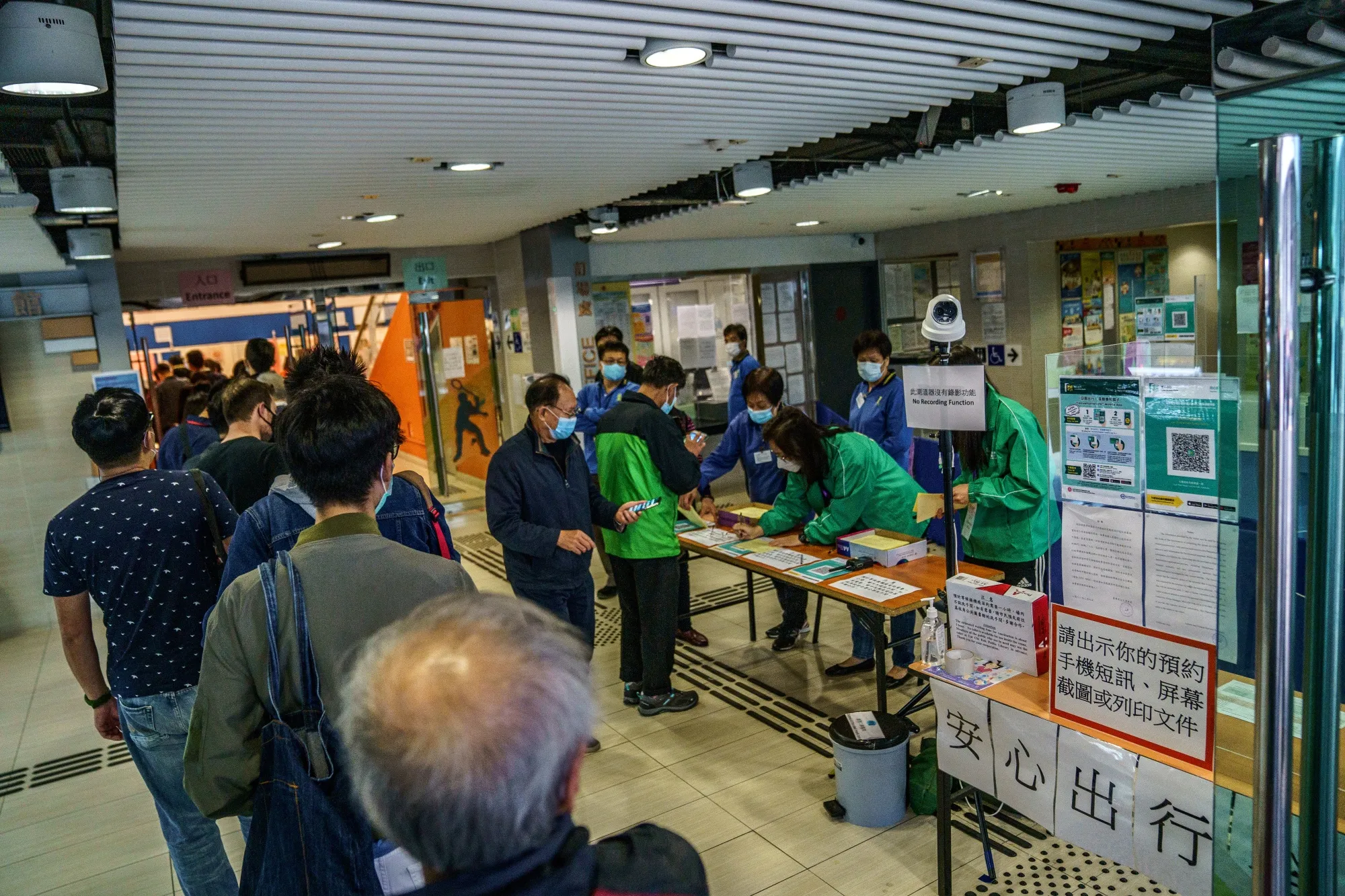People line up at a community vaccination center administering the BioNTech Covid-19 vaccine in Hong Kong on March 10.