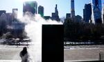 A person keeps warm&nbsp;near a steam pipe during cold&nbsp;temperatures in Central Park in New York City on Jan.&nbsp;11.