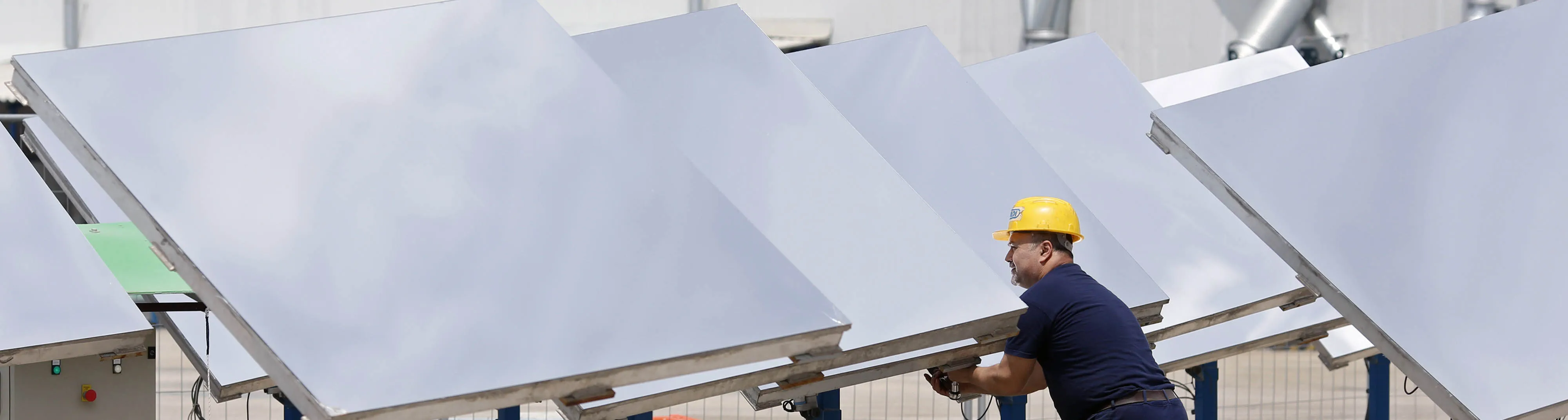 An employee carries out maintenance work on heliostat panels at a Solar Thermoelectric Magaldi (STEM) pilot plant, operated by Magaldi Power SpA, in Buccino, Italy, on Monday, May 18, 2015. The project captures the energy of the sun which is transferred via the generation unit to heat retaining silica sand, producing steam that powers a turbine and is suitable for use in systems operating over a large temperature range.
