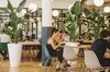 Members of WeWork sit at one of the company’s spaces in New York.