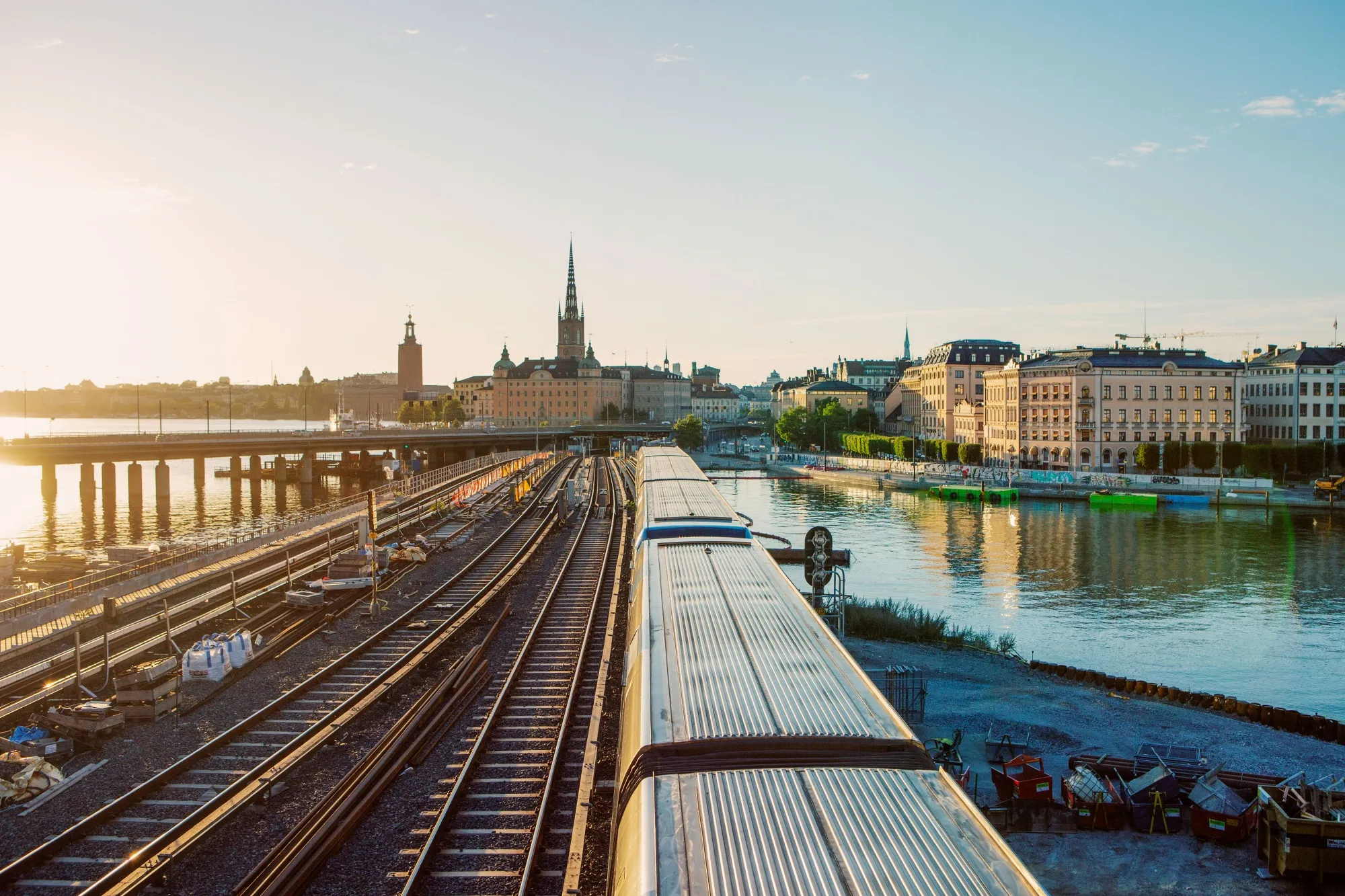A train travels along railway tracks towards Gamla Stan in Stockholm.
