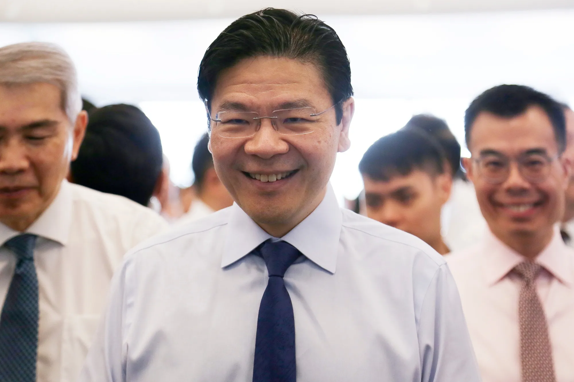 Singapore Prioritizes Jobs Amid Fragmenting World, Rise of AI - Bloomberg