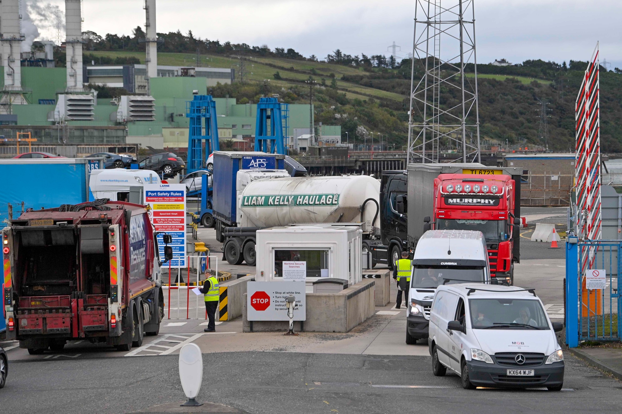 Trucks enter and leave Larne Port in Larne, Northern Ireland, UK.