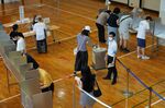 Voters cast a ballot at a polling location in the Minato District of Tokyo, Japan, on&nbsp;July 10.