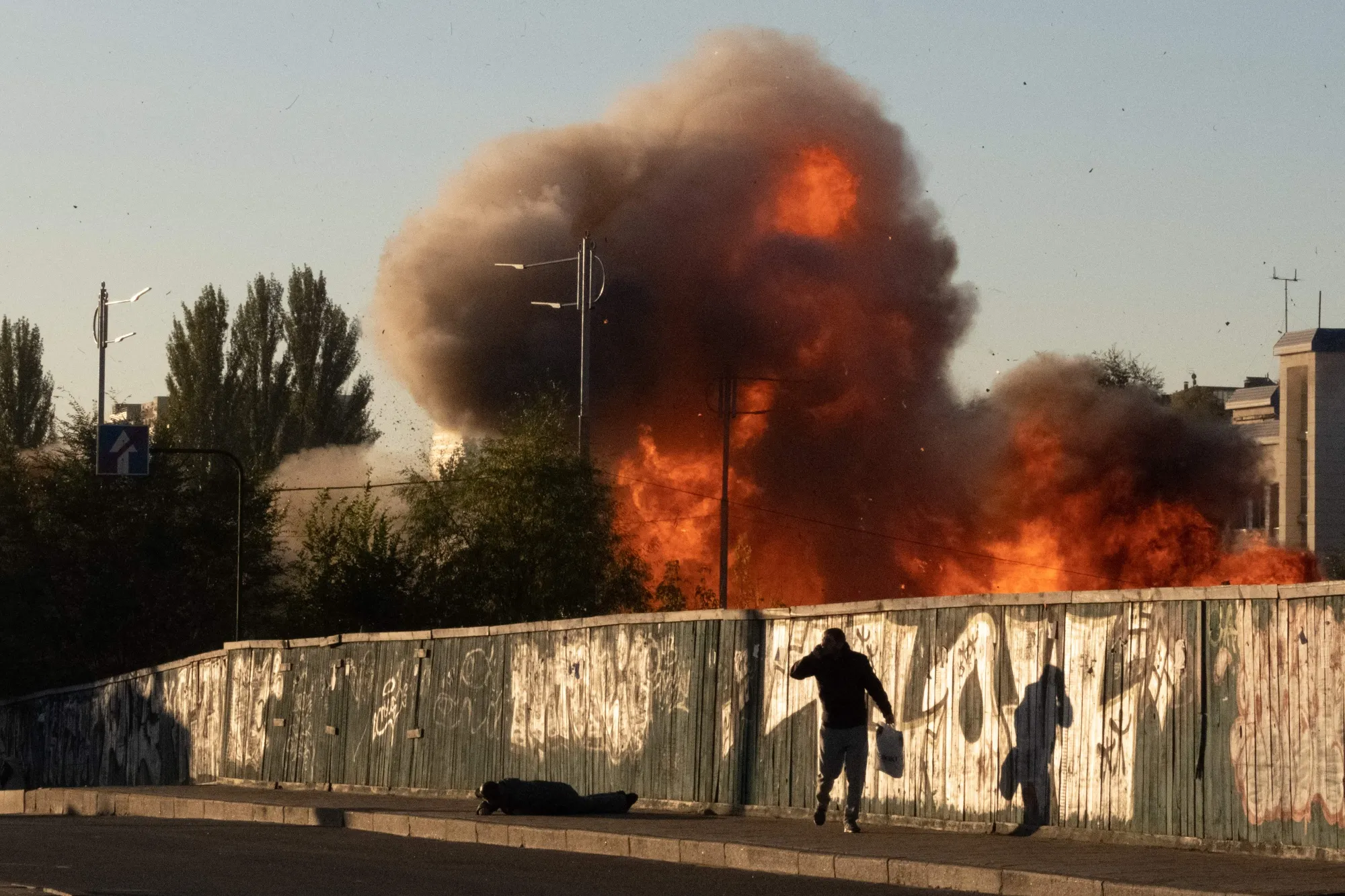 Flames rise following a Russian kamikaze drone attack in Kyiv on Oct. 17.