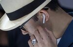 An attendee wears the Apple Inc. AirPod wireless headphones during an event in San Francisco on Sept. 7, 2016.
