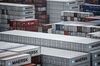 Shipping containers stacked at the Guangzhou Nansha Container Port are seen from CMA CGM SA's Benjamin Franklin container ship docked at the terminal in Guangzhou, China, on Monday, Feb. 1, 2016. The Benjamin Franklin is the largest container ship ever to have docked at a U.S. port.