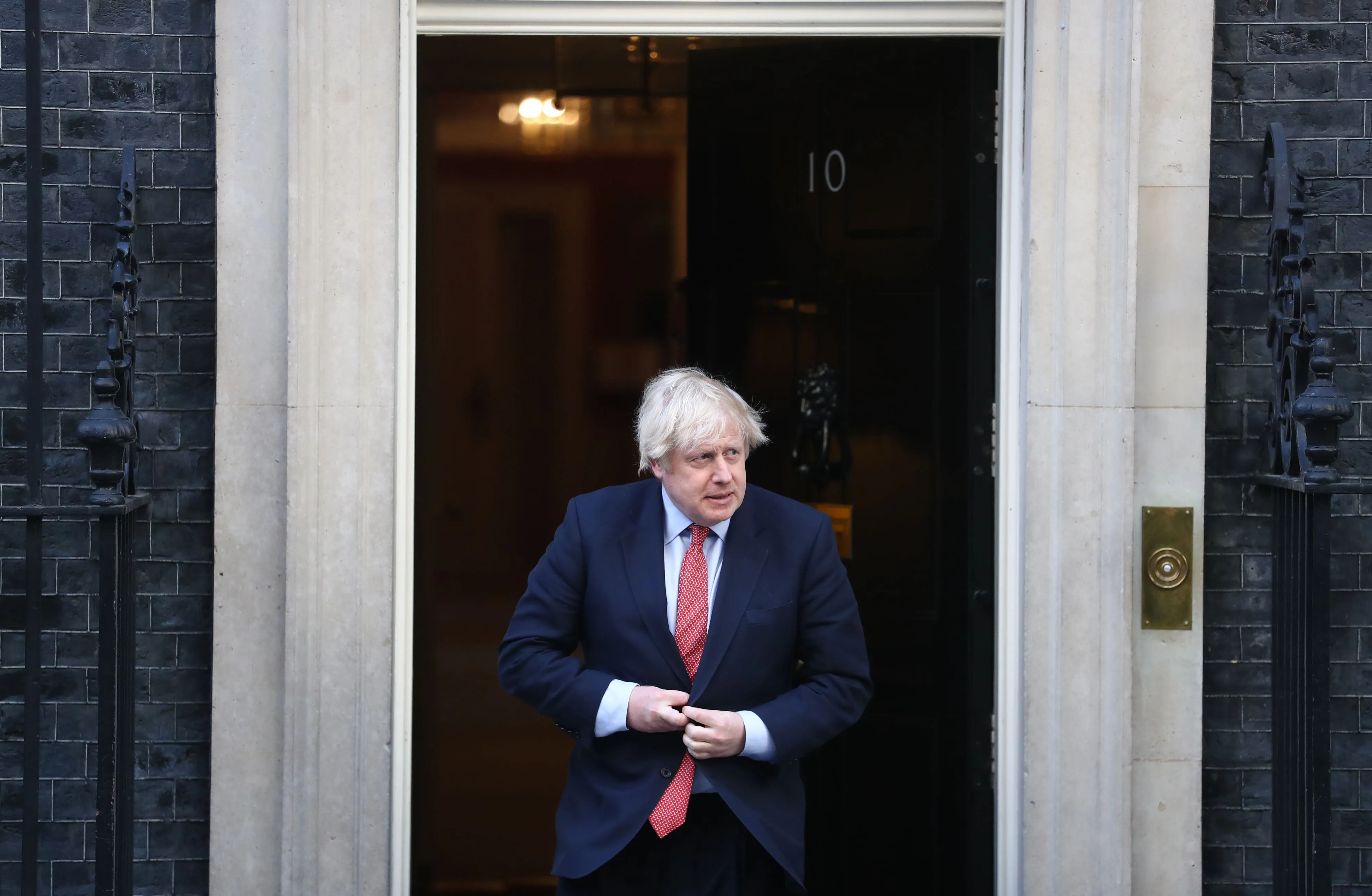Boris Johnson, U.K. prime minister, exits number 10 Downing Street during a national round of applause to show appreciation for health workers in London on May 28, 2020.&nbsp;