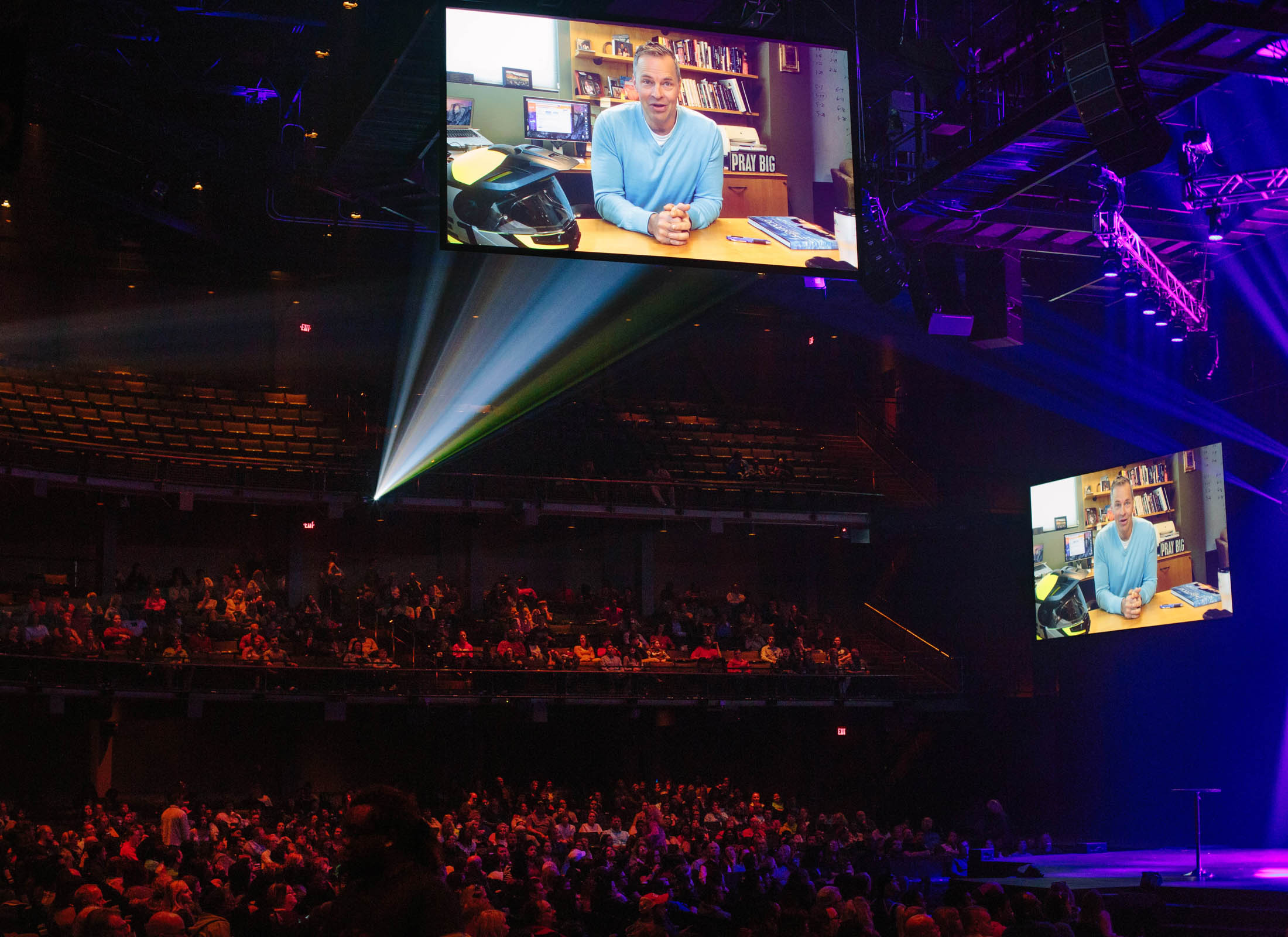 Brian Tome, senior pastor at Crossroads, appears in a recorded message during a service in Cincinnati.
