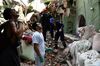 People remove debris of a collapsed building in Mexico City on Sept. 19.