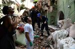People remove debris of a collapsed building in Mexico City on Sept. 19.