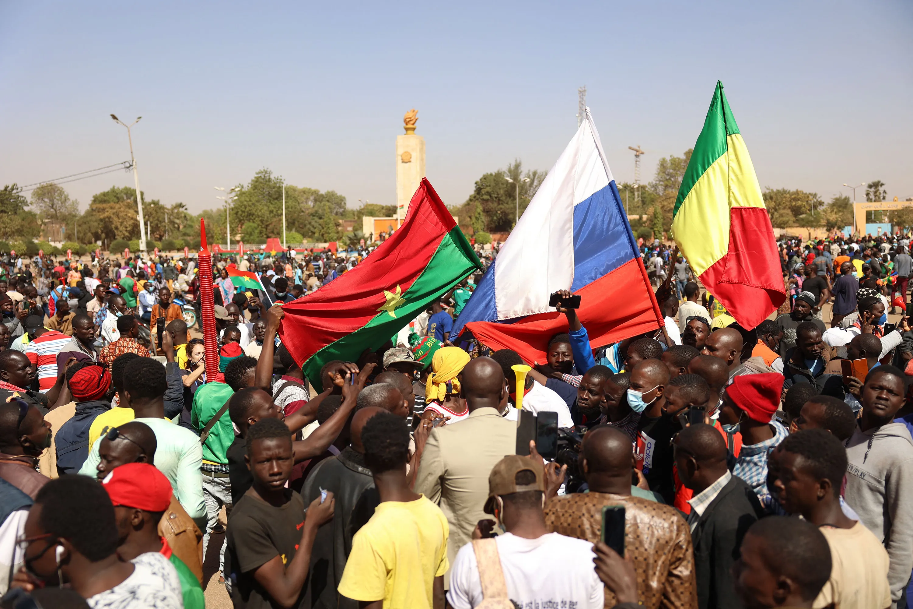 Demonstrators gather to show support to the military while&nbsp;waiving a Russian flag&nbsp;in Ouagadougou, Burkina Faso, on Jan. 25.