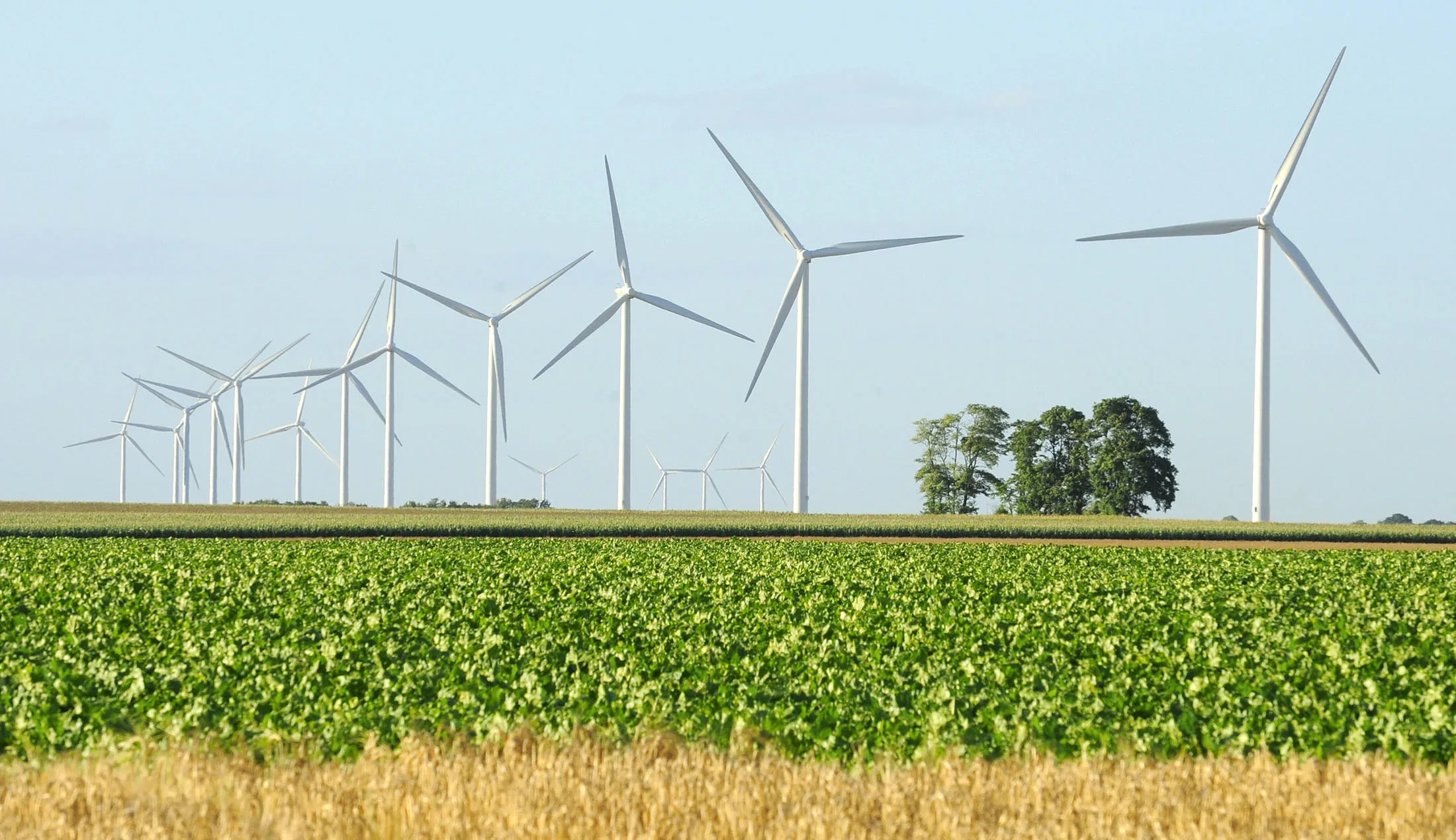 Wind turbines operate in Lethuin, France.
