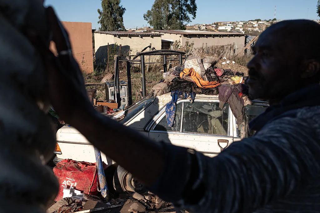 A resident of an informal settlement&nbsp;in front of his belongings after a flood near Mthatha, on June 12.&nbsp;