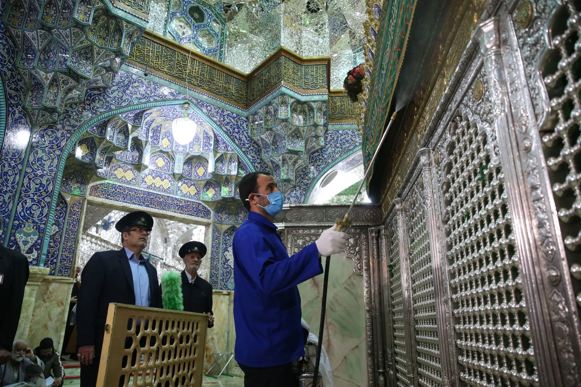 Iranian sanitary workers disinfect Qom's Masumeh shrine on February 25.
