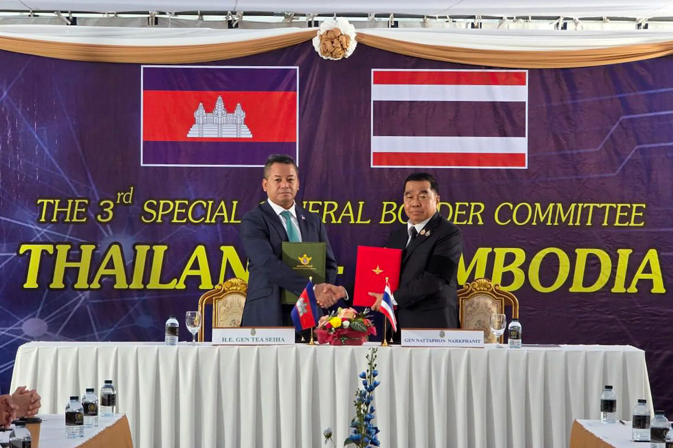 Cambodian Defense Minister Tea Seiha, left, and Thai Defense Minister Natthaphon Narkphanit after signing a ceasefire agreement in Chanthaburi Province, Thailand, in this photo released by the Cambodian government on Dec. 27.