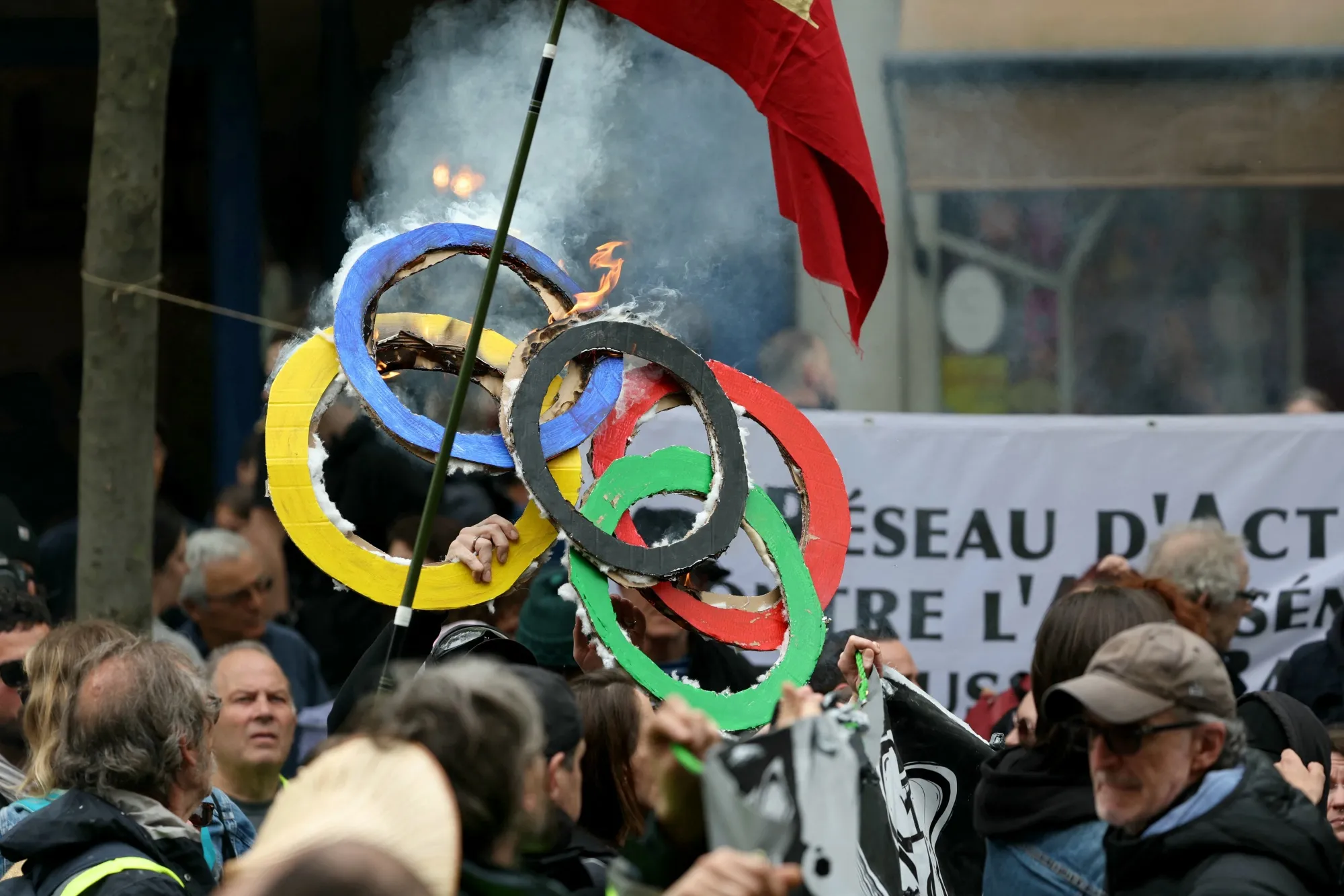 May Day protesters in Paris show what they think of the Olympics.